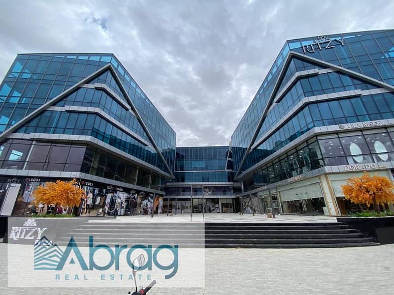 For sale, a 50-meter commercial shop, immediate delivery, with a distinctive view, Ritzy Mall, Sheikh Zayed 6