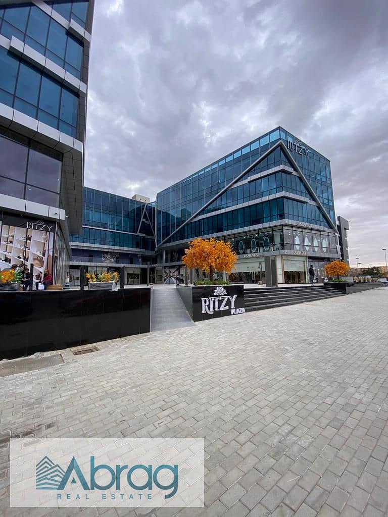 For sale, a 50-meter commercial shop, immediate delivery, with a distinctive view, Ritzy Mall, Sheikh Zayed 7