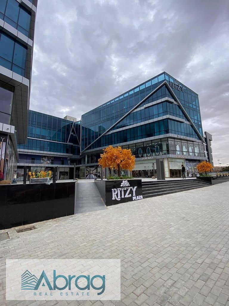 For sale, a 50-meter commercial shop, immediate delivery, with a distinctive view, Ritzy Mall, Sheikh Zayed 11