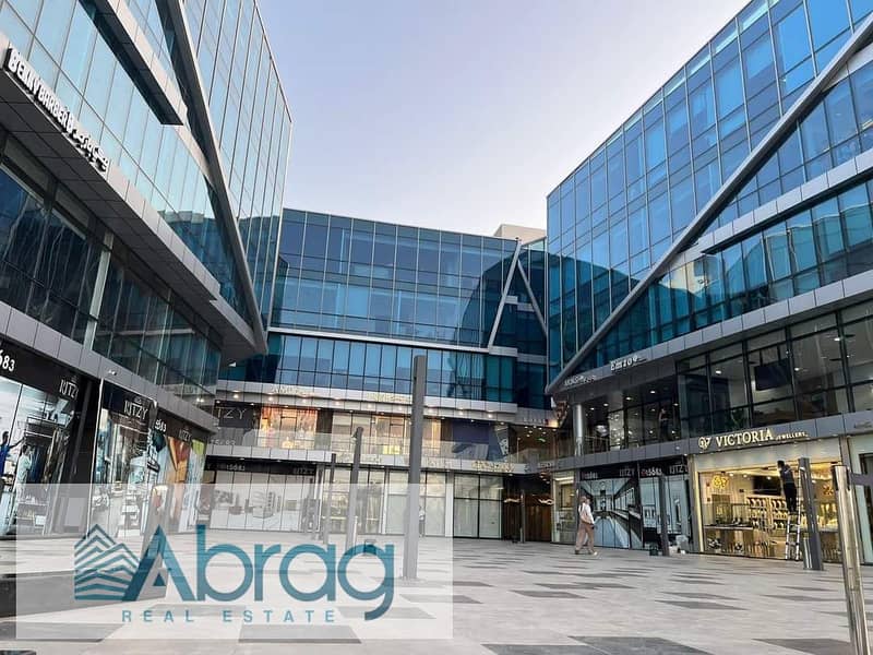 For sale, a 50-meter commercial shop, immediate delivery, with a distinctive view, Ritzy Mall, Sheikh Zayed 12