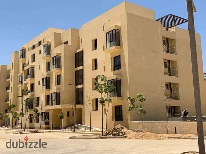 apartment two-bedroom in front of Mall of Egypt in O West by Orascom, available for sale at the launch price with installment options. 0