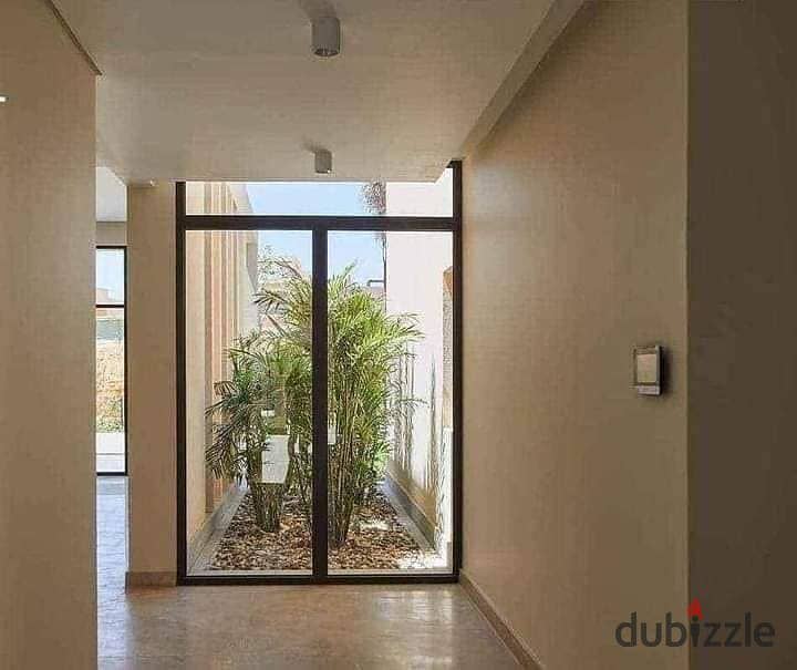 apartment two-bedroom in front of Mall of Egypt in O West by Orascom, available for sale at the launch price with installment options. 9