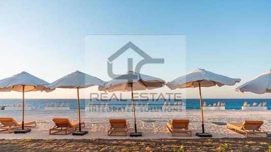 In installments up to 4 years, own a ground chalet with a garden, fully finished, with air conditioners, direct view on Crystal Lagoon, in Naguib Sa