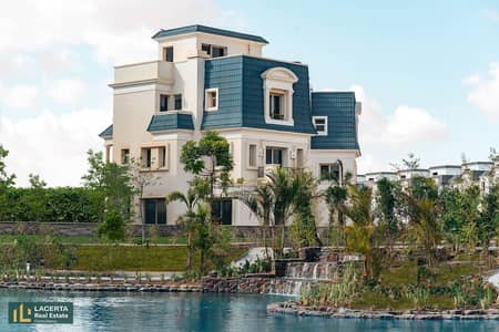 Villa in Kings Way Mountain View on the artificial lakes at the entrance to Sheikh Zayed 4