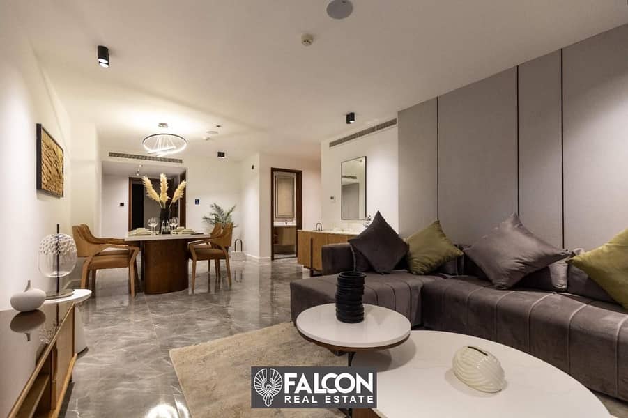 For sale, a two-bedroom hotel apartment, 124 m, with hotel service, managed by Marriott International Hotels, “in Marriott Residence”, directly next t 1