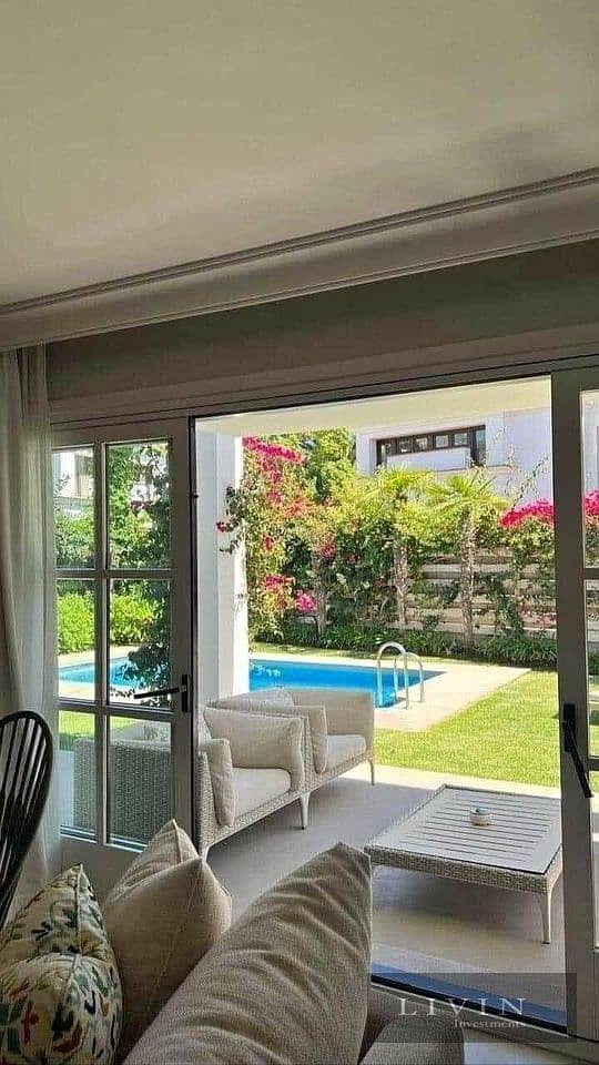 At the old price, 4-room garden villa, 208m, for sale, double view, in front of the Kempinski Hotel and Cairo Airport, in Taj City Compound. new cairo 1