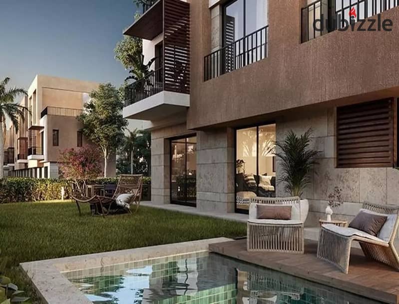 Corner townhouse for sale with extended installment plans, featuring 5 bedrooms, in Village West compound, one of the prime locations in Sheikh Zayed, 4