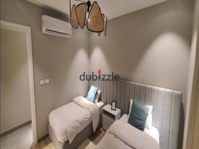 Corner townhouse for sale with extended installment plans, featuring 5 bedrooms, in Village West compound, one of the prime locations in Sheikh Zayed, 13