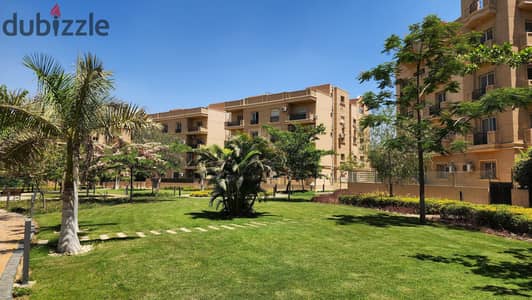 For sale, an apartment with a garden, ready for immediate delivery, in Sheikh Zayed, behind Mall of Arabia, in installments