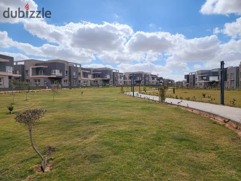 Ground floor apartment with a garden, immediate delivery, fully finished, double view, in Sheikh Zayed, in the heart of Grand Heights, in installments 2