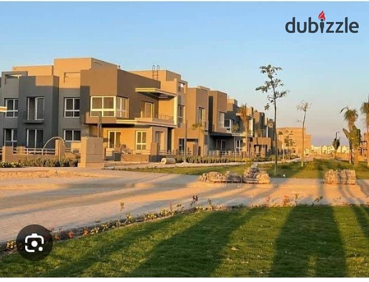 Ground floor apartment with a garden, immediate delivery, fully finished, double view, in Sheikh Zayed, in the heart of Grand Heights, in installments 11