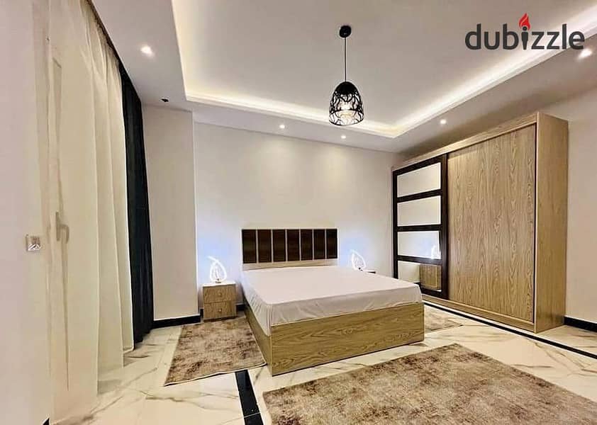 Apartment ready for viewing and immediate delivery, fully finished with air conditioning and a kitchen, for sale in the LA CAPITAL compound w 2