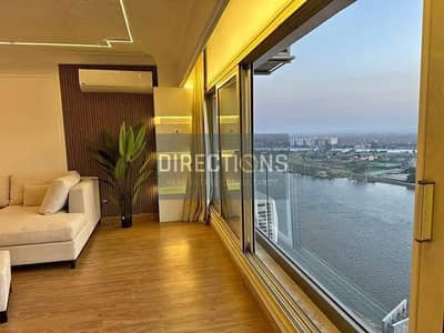 Apartment with hotel finishing + ACs + furniture Nile view beside Hilton Maadi Hotel in Reve Du Nil | With rental income | Near Salam Hospital