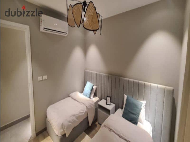 An attractive offer for an immediate delivery apartment, fully finished with air conditioners, located in Village West, the most luxurious 11