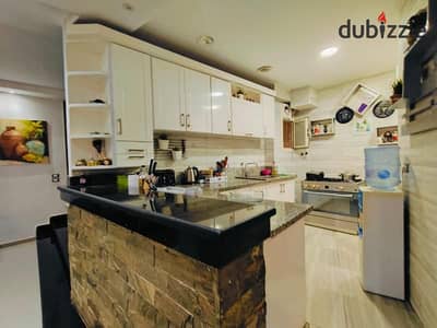 Duplex with garden for sale with kitchen behind Mall of Arabia in Murouj Compound next to Green Heights