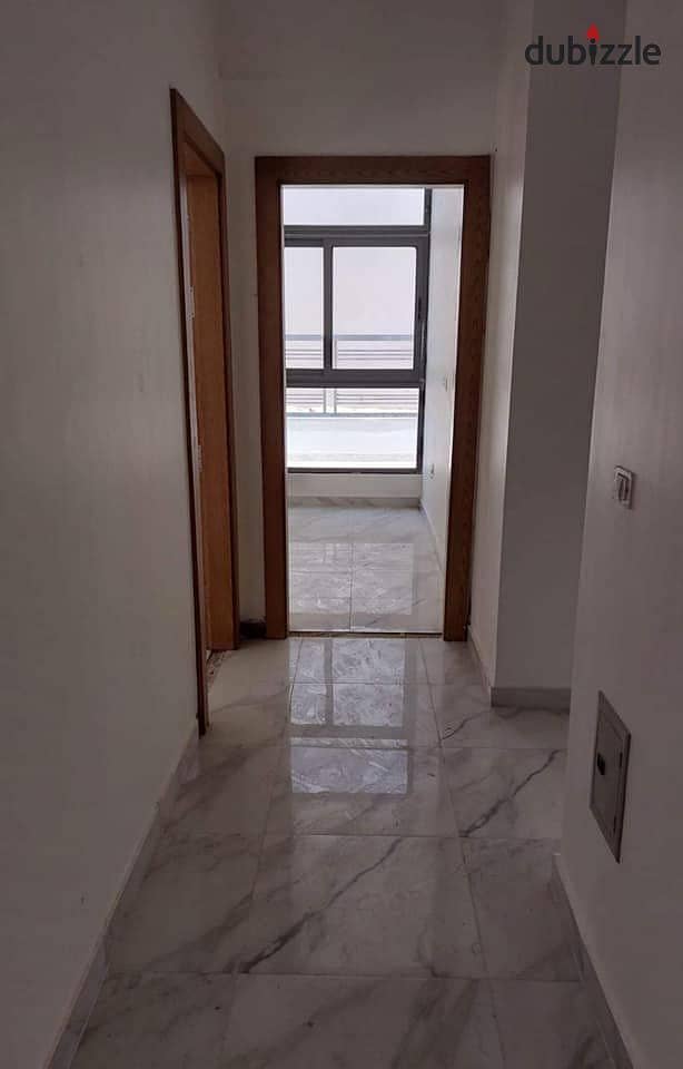 Apartment for sale with the lowest down payment and installments over 10 years in the heart of the Fifth Settlement in front of the American Universit 7