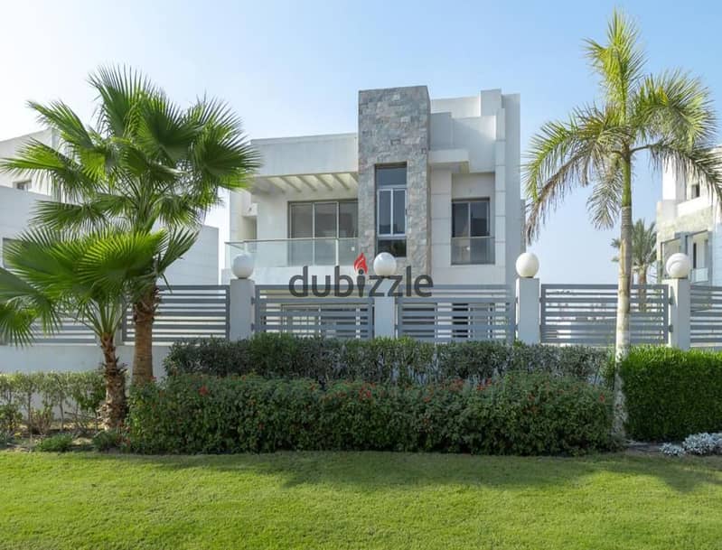 A 730 sqm villa is available for sale with an installment plan in Cleopatra Square compound, located in the prime area of Eastern expansions in Octobe 2