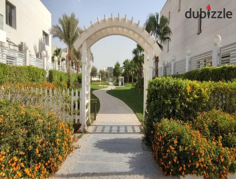 A 730 sqm villa is available for sale with an installment plan in Cleopatra Square compound, located in the prime area of Eastern expansions in Octobe 3