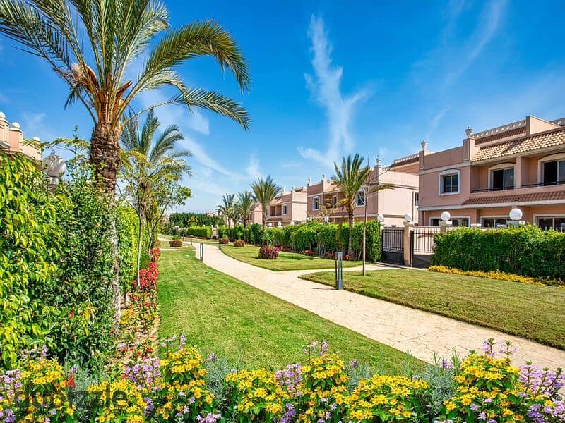 A 730 sqm villa is available for sale with an installment plan in Cleopatra Square compound, located in the prime area of Eastern expansions in Octobe 11