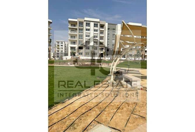 130 m apartment with installments, finished, view, landscape, in a very special location, with a down payment below the market price, in Fifth Square 4