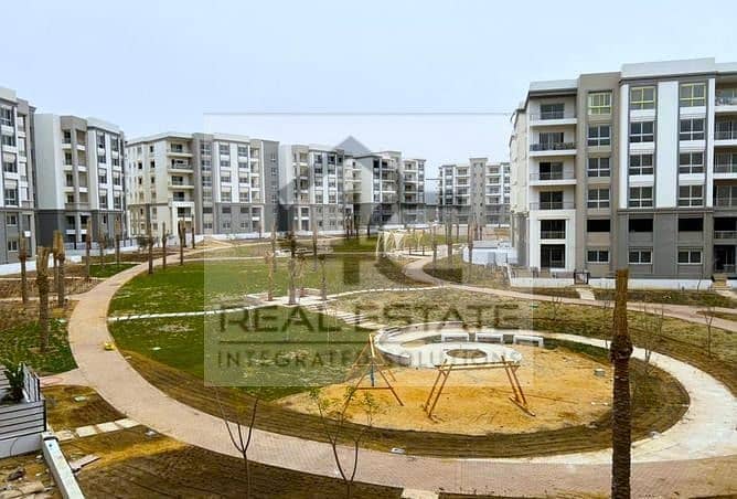 130 m apartment with installments, finished, view, landscape, in a very special location, with a down payment below the market price, in Fifth Square 6