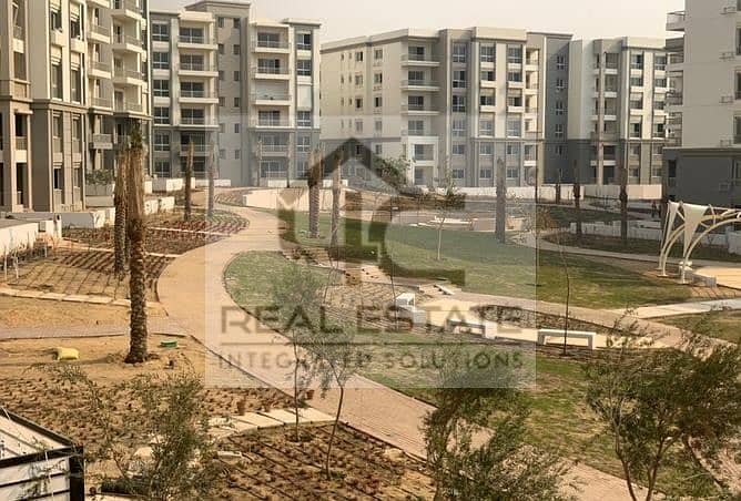 130 m apartment with installments, finished, view, landscape, in a very special location, with a down payment below the market price, in Fifth Square 9