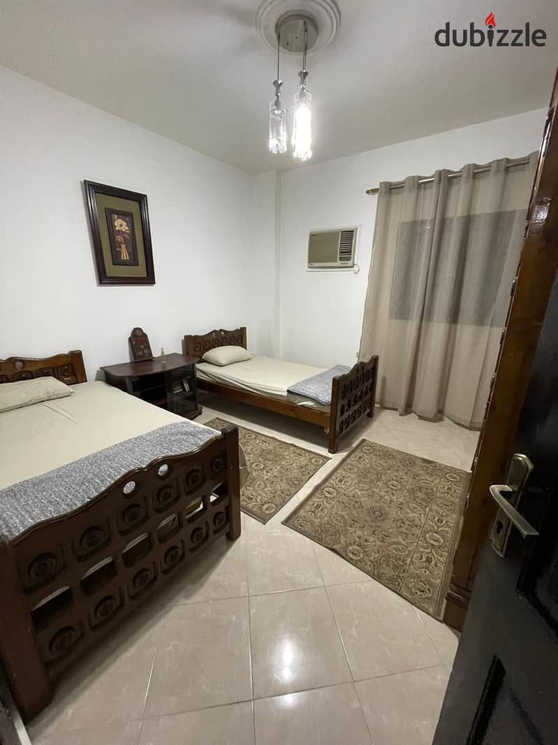 A fully furnished apartment for rent in Al Narges Buildings in the Fifth Settlemen 8