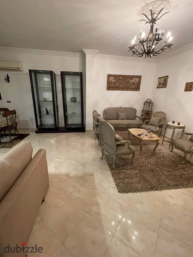 A fully furnished apartment for rent in Al Narges Buildings in the Fifth Settlemen 12