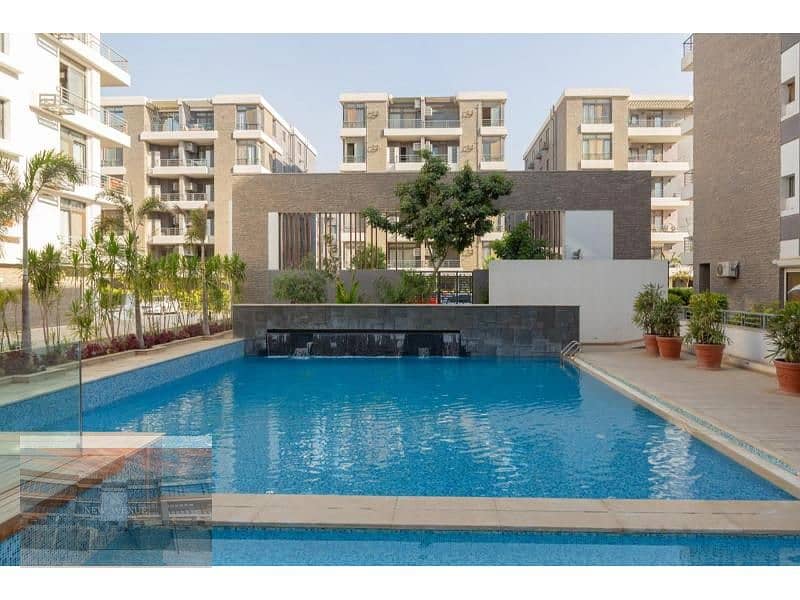 Apartment ground with garden Ready to move - in Taj city - with best price - 2 bedroom - 14