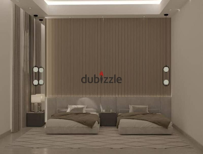 A 4th-floor apartment is available, featuring a prime location of 185 m² with hotel-style finishing, situated in Sheikh Zayed in front of Zed Towers a 9