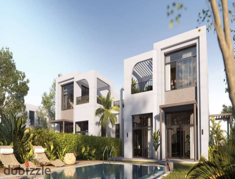 The user lives in O West in a 400-square-meter villa, purchased through a long-term installment plan, in a prime location directly on Al Wahat Road. 2