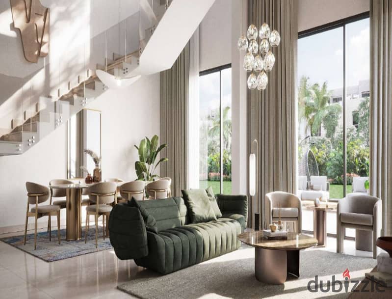 The user lives in O West in a 400-square-meter villa, purchased through a long-term installment plan, in a prime location directly on Al Wahat Road. 3