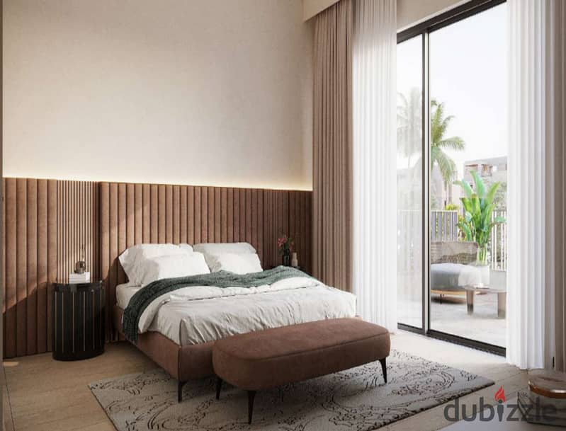 The user lives in O West in a 400-square-meter villa, purchased through a long-term installment plan, in a prime location directly on Al Wahat Road. 8