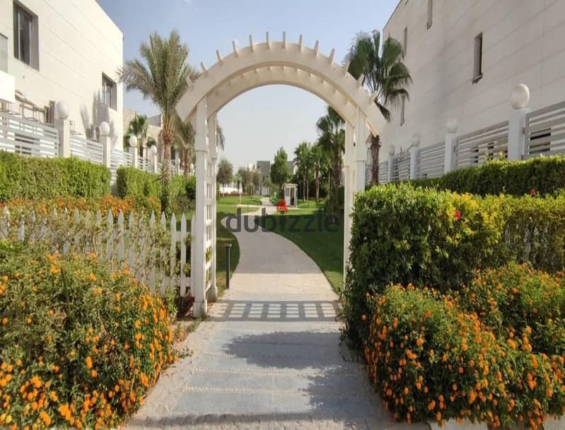 A 335-square-meter twin house is available for immediate delivery in Cleopatra Square compound, Sheikh Zayed, with an installment plan. 4