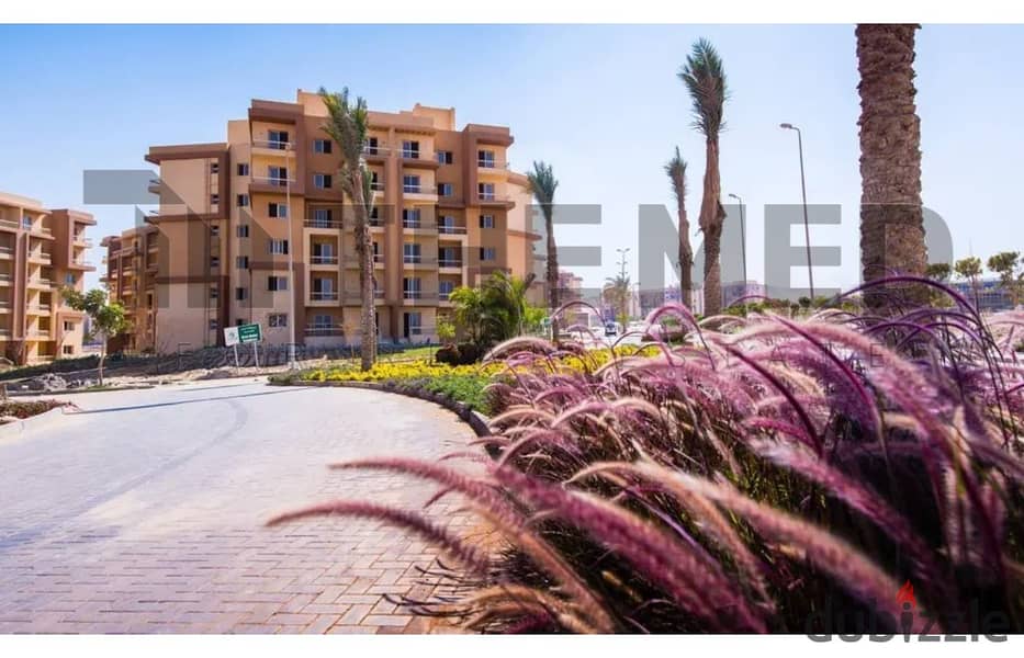 Large apartment with garden in Ashgar City Compound, for sale in October, semi-finished, ready to move, in hadayk October , near Al Fardous, O West 1