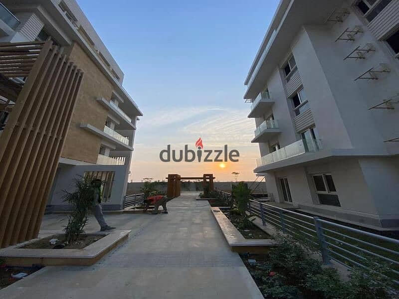 Live in Mountain View Sheikh Zayed in installments, an apartment with a distinctive view behind Mall of Arabia in installments 3