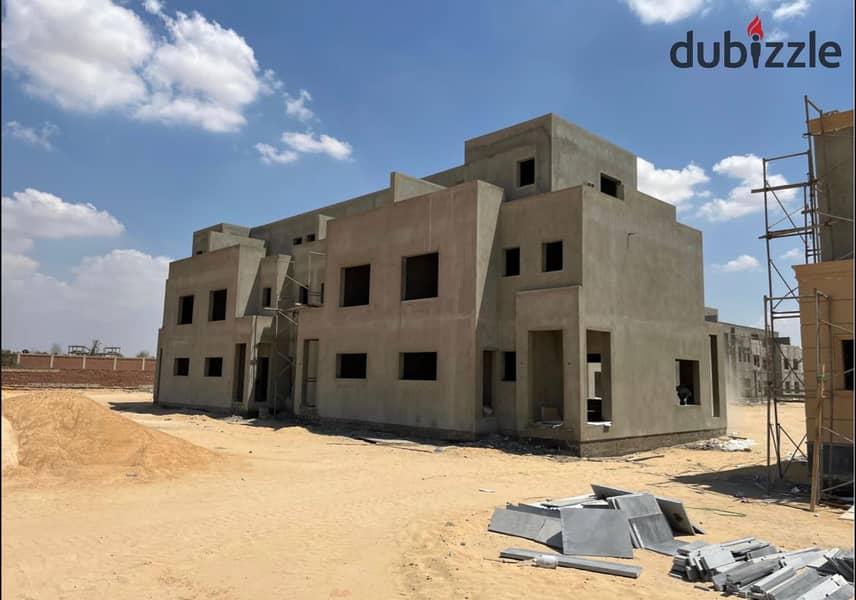 Own a villa in installments over 9 years, in a prime location in Sheikh Zayed, next to EMMAR 12