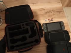 Nintendo switch v2 with 3 games and 1 jumbo case and 1 small case 0