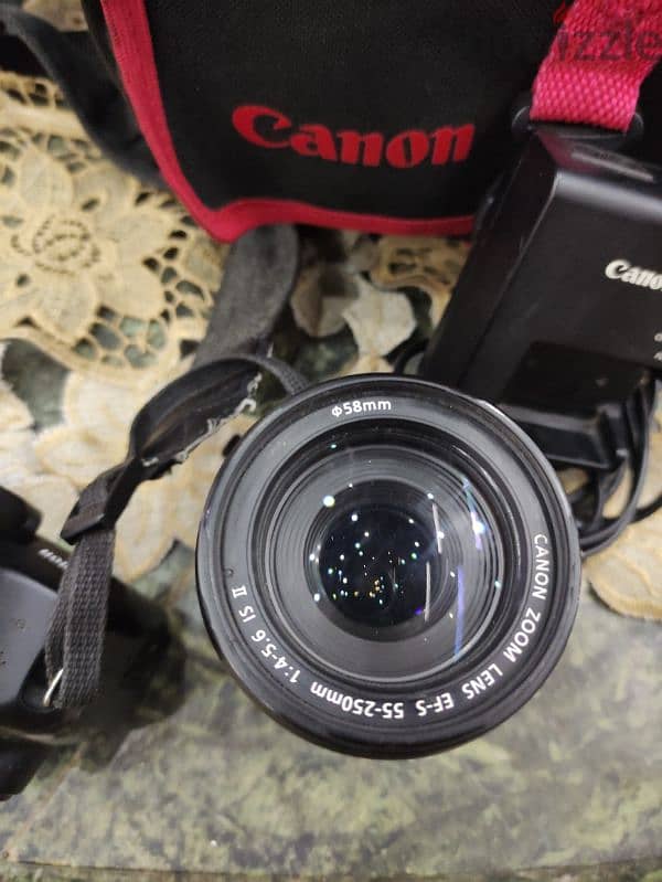 canon 1200 d with lens 55-250 6