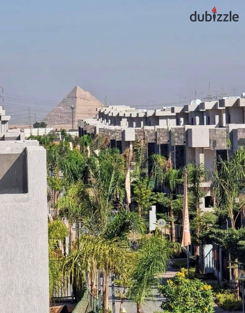 Live in a fully finished apartment in installments with a view of the pyramids in the tourist capital in SUN CAPITAL 11