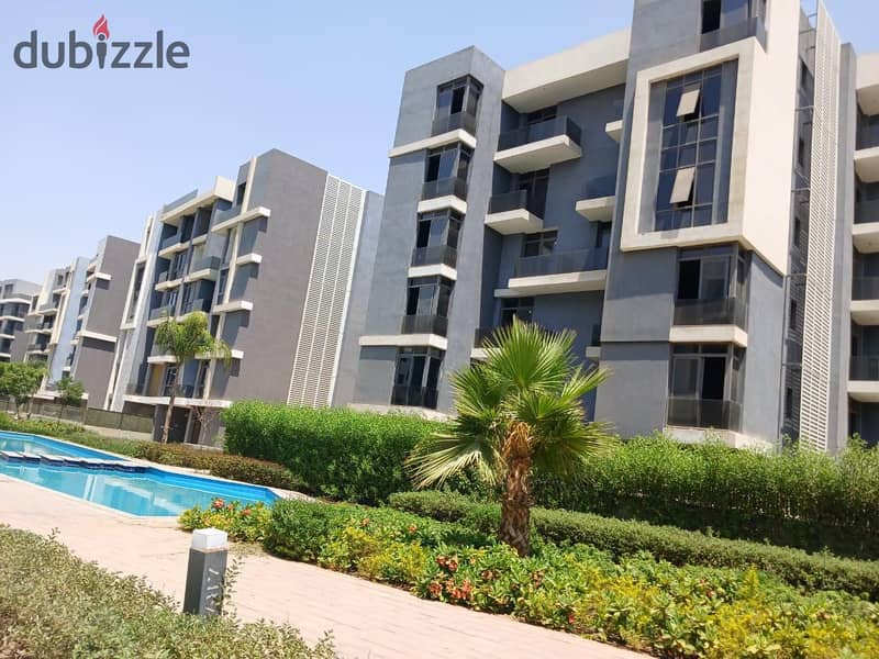 Live in a fully finished apartment in installments with a view of the pyramids in the tourist capital in SUN CAPITAL 22