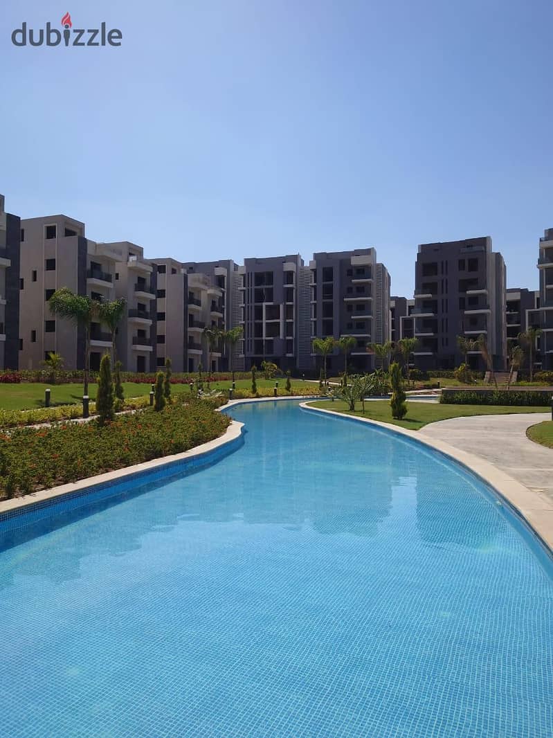 Live in a fully finished apartment in installments with a view of the pyramids in the tourist capital in SUN CAPITAL 27