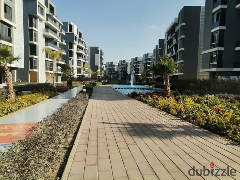 Live in a fully finished apartment in installments with a view of the pyramids in the tourist capital in SUN CAPITAL 29