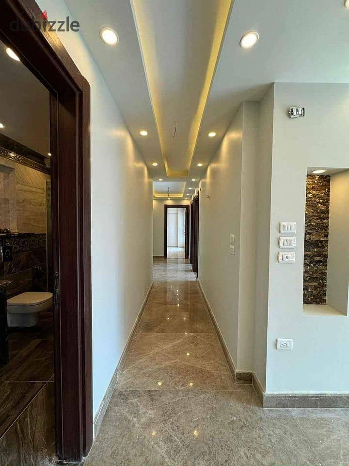 Apartment for sale, immediate receipt, finished, with air conditioners and kitchen, in the Capital Compound in the New Administrative Capital. 1