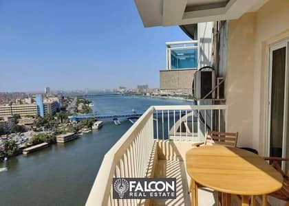 A hotel apartment ready to live in, furnished and equipped with hotel service, with a full view of the Nile Corniche, next to the Helion Hotel