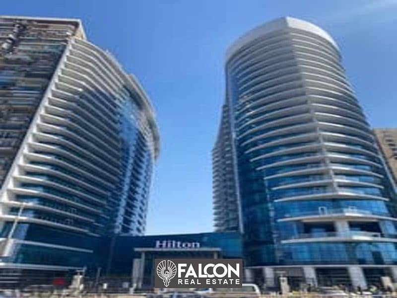 Own now a hotel apartment managed by Hilton ((immediate delivery)) with a direct view of the Nile and full hotel services, Nile Pearl Towers 1