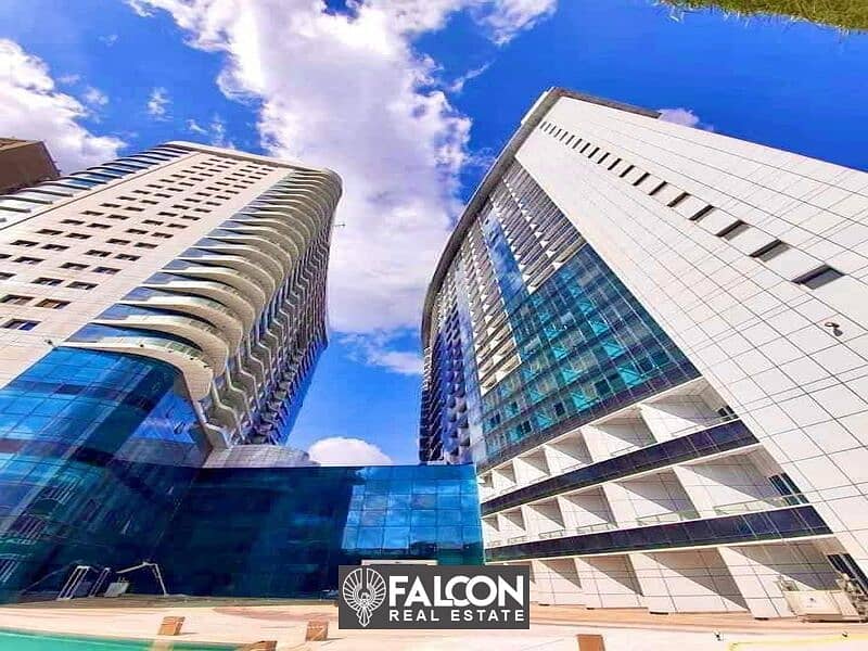 Own now a hotel apartment managed by Hilton ((immediate delivery)) with a direct view of the Nile and full hotel services, Nile Pearl Towers 2