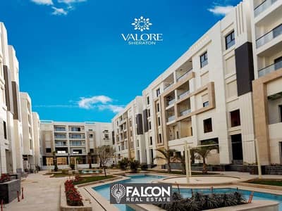 2-BR hotel apartment in front of the airport gate in Sheraton, close receipt, fully finished, in Aljar - Valore compound, next to Almaza City Center