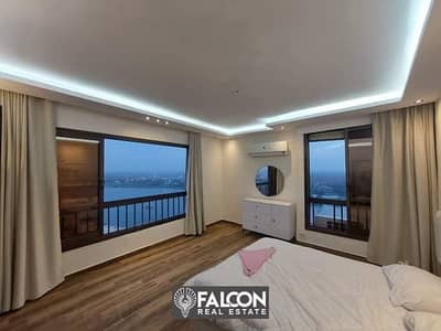 40 m hotel apartment with a full view of the Nile Corniche in Maadi, fully finished, for sale under the management of the Hilton Hotel, with a dow