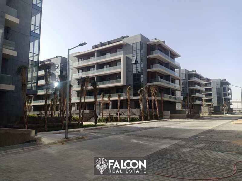 A luxurious apartment with a private garden, fully finished, immediate receipt, ready to move in El Patio 7 Compound - Fifth Settlement - New Cairo 3